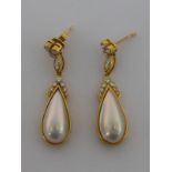 A pair of 18 carat yellow gold, diamond and cultured pearl drop earrings, the tear drop pearl 20.