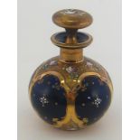 A globular Bristol blue scent flask with enamelled flowers in bright and matted gilt panels and on