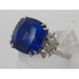 A tanzanite and diamond dress ring, the cushion cut stone 11.2mm x 11.1mm x 8.