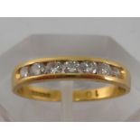 An 18 carat yellow gold seven stone diamond ring,