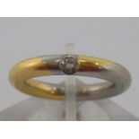 Meister . A platinum, gold and diamond ring by Meister, the round brilliant cut diamond weighing 0.