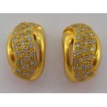 A pair of yellow metal (tests 18 carat gold) diamond earrings, approx 1.5 cm, 6.1 gms.