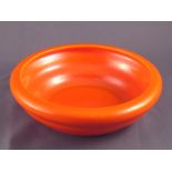 A Zsolnay orange glazed open bowl, impressed mark “Zsolnay”. 17.5cm. across.