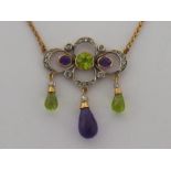 An Edwardian 'Suffragette' style peridot, amethyst and diamond pendant,