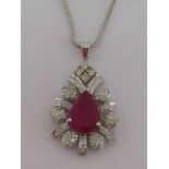 A rubellite and diamond pendant, the central pear shaped stone 14.2mm x 9.