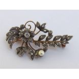 A 19th century French gold-backed silver and diamond spray brooch, set overall with rose and eight-