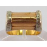 An Art Deco 18 carat two colour gold ring, the shank stamped ‘750’, finger size M, 5.8gms