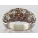 An Italian 18 carat white gold and diamond ring by Valente, the bombe bezel pave set overall with