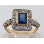 An Art Deco sapphire and diamond plaque ring, the central rectangular cut sapphire 6.1 x 4.4mm in