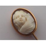 A Victorian shell cameo stick pin, the oval cameo depicting the head of a cherub in high relief,