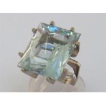 An aquamarine dress ring, the large rectangular cut stone 20.2 x 17 x 11.2mm, the white gold squared