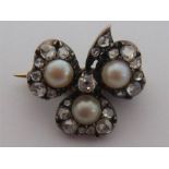 An early 19th century diamond and split pearl clover brooch, the three leaves set with 4.7mm split