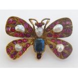 A late 19th century yellow metal (tests 18 carat gold), ruby and blister pearl butterfly brooch, the