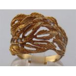 A 1970s gold (tests 18 carat) dress ring, designed as overlapping fronds, set with cubic zirconia,