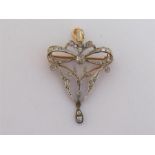 A Belle Epoque diamond brooch/pendant, circa 1900, the open work bow and swag motif in gold backed