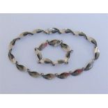 A Modernist Danish silver necklace and bracelet by Aarre & Krogh (1949-1990), composed of stylised