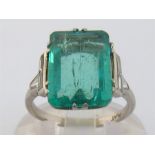 An Art Deco emerald and diamond ring, the emerald cut stone 13.1 x 8.9 x 4.2mm (approx. 3.32