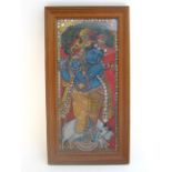 A 19th. century Indian multi media painting on teak panel of the Hindu deity Krishna playing a flute