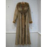 A full length fox and rabbit fur coat by Christian Dior, slim fit, the beige lace trim coat with