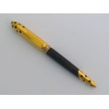 Cartier Panthere, a gold plated and black lacquer ballpoint pen, circa 1990, signed to the clip,