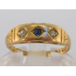 A late Victorian 18 carat gold, diamond and sapphire ring, the three small gypsy set stones