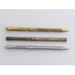 Three Aurora slim line ballpoint pens, including a two silver examples, no box or paperwork