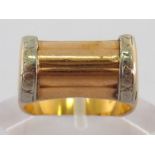 An Art Deco 18 carat two colour gold ring, the shank stamped ‘750’, finger size M, 5.8gms