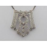 A French Art Deco diamond pendant, the openwork geometric motif set overall with transition cut