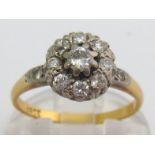 A 1930s diamond cluster ring, the central old brilliant approx. 0.16 carat, total diamond weight