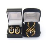 Two pairs of 9 carat gold and gem set earrings, including one pair set with cultured pearls, and