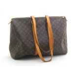 Louis Vuitton:- a brown coated canvas and leather lady’s monogrammed luggage bag, approx. 50 cm.