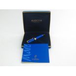 Aurora, ‘La Mare’, and blue marbled resin and gold plated ballpoint pen, in a fitted Aurora box,