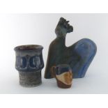 Three ceramics, comprising a Danish studio pot with seed pod decoration and raku style glaze by