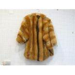 A large half-length fox fur coat by Matti, Milan, Italy, with brown leather and satin trim (