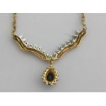 A 9 carat gold diamond and sapphire pendant necklace (3.6 gm.) and a pair of cultured pearl ear-