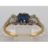 A sapphire and diamond three stone ring, the central square cut sapphire 3.5 x 3.6mm, between two