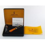 Delta, Dolce Vita, an orange marble and black resin fountain pen, with medium 18 carat gold nib,