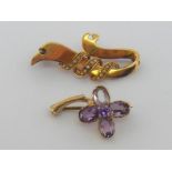 A 9 carat gold and amethyst clover brooch, fully hallmarked to the stem, 2.7cm long, 3.2gms;