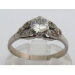 A single stone diamond ring, the old cut brilliant approx. 0.4 carat, to diamond set shoulders,