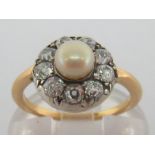 A pearl and diamond cluster ring, the central (untested) pearl 5.5mm, in a surround of old