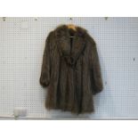 A large half-length marmot fur coat by Annabella, Pavia, Italy, with patterned brown silk lining,