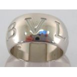 BVLGARI, an 18 carat white gold ring by Bulgari, the broad convex band inscribed 'BVLGARI',