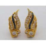 A pair of sapphire and diamond ear clips, each principal brilliant cut diamond approximately 0.23