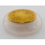 A pretty French gold-mounted rock crystal bonbonniere, circa 1890, of oval cushion form carved