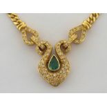 An emerald and diamond pendant, the central pear cut emerald approx. 0.41 carat, rub over set in a