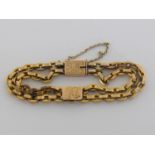 A late Victorian 15 carat gold facetted curb link bracelet, to an engraved box link clasp, with