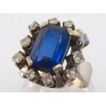 A diamond and synthetic sapphire dress ring, the large rectangular cut stone 12.8 x 9.5mm, in a