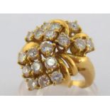 A diamond cluster ring, the spray cluster claw set with nineteen brilliants, totalling approx. 1.9