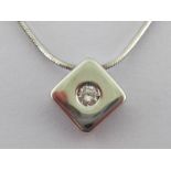 A diamond pendant, the rhomboid pendant with a rub over set small brilliant, to an 18 carat white