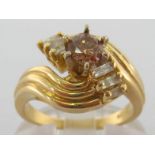 A fancy coloured diamond ring, the central untested brown brilliant cut diamond approx. 0.4 carat,